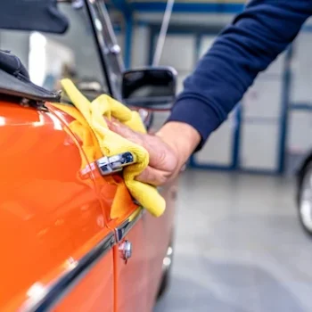 manual-cleaning-of-the-exterior-of-an-old-car-cab-2026-03-17-06-38-59-utc